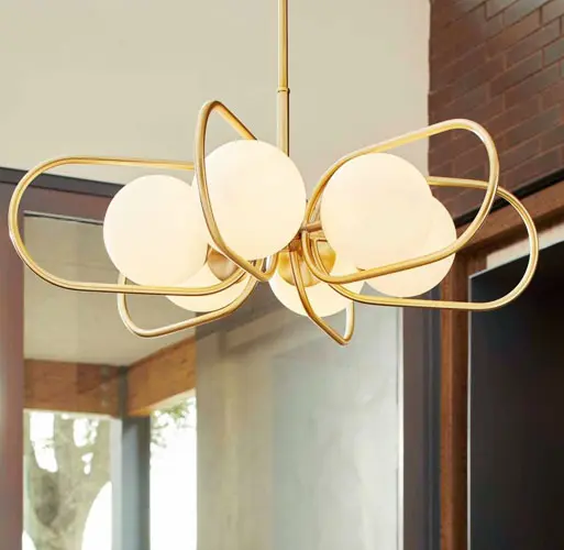 mid century modern chandelier with gold loops and globe shaped lights